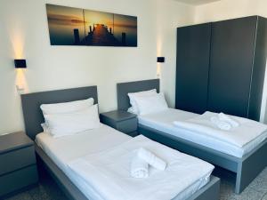 Postel nebo postele na pokoji v ubytování Lipp Apartments