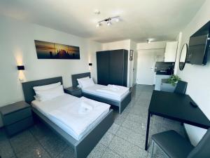 Postel nebo postele na pokoji v ubytování Lipp Apartments