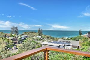 a view of the ocean from a deck at Blue Waters in Point Lookout