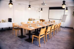 a large conference room with a long table and chairs at Hotel Mokotów in Warsaw