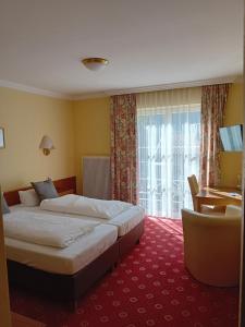 Posteľ alebo postele v izbe v ubytovaní Landhotel Steindlwirt