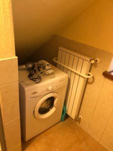 a washer and dryer in a small room at Planavilla in Doues