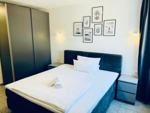 Postel nebo postele na pokoji v ubytování Lipp Apartments + 26 fotografií