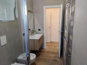 a bathroom with a sink and a toilet at Casa Mikaela sea view in Vieste