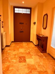 a hallway with a door and a sink and a mirror at Mare e Relax Portosole in Sanremo