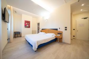 Postel nebo postele na pokoji v ubytování Hotel San Pancrazio