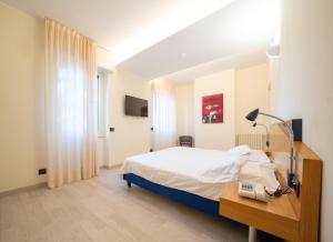 Postel nebo postele na pokoji v ubytování Hotel San Pancrazio