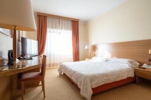Postel nebo postele na pokoji v ubytování Hotel San Pancrazio