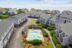 an aerial view of a neighborhood with houses and a pool at Oceanview Townhouse w/ Pool - Newly Renovated in Surf City