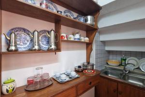 Virtuve vai virtuves zona naktsmītnē Comodissima casa per vacanza