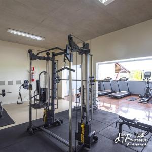 a gym with several tread machines in a room at Caldas Novas - Diroma Fiori - Incluso Parque 24 Horas - Com roupas de cama Incluso in Caldas Novas