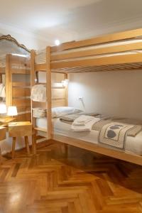 a bedroom with two bunk beds and a desk at Cianis Home San Marco - Apartment in Venice