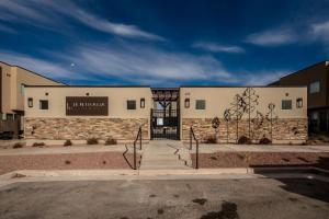 a building with a sign on the front of it at Entrada at Moab 624 and 632 in Moab