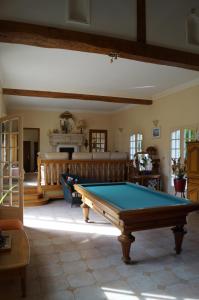 a living room with a pool table in it at Le Relais De Dalibray in Seraincourt