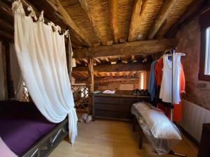 a bedroom with a bed and a dresser in a room at La Cabaña 