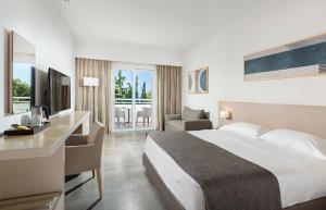 Postel nebo postele na pokoji v ubytování Platanista Hotel