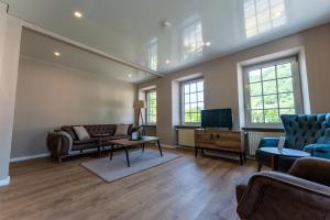 TV a/nebo společenská místnost v ubytování Moselresidenz Bellevue Alf Apartment Alfbach
