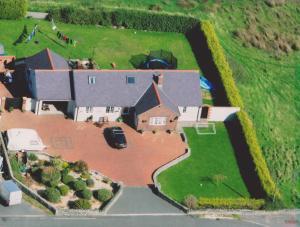 an aerial view of a house with a yard at Craig Eithin B & B in Holyhead