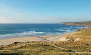 an aerial view of a beach and the ocean at The Barn in St. Just