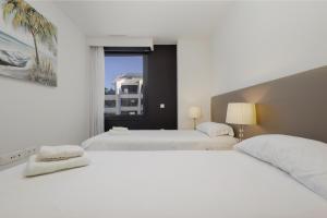 Posteľ alebo postele v izbe v ubytovaní Apartment next to the beach in Dunes Beach + 37 fotografií