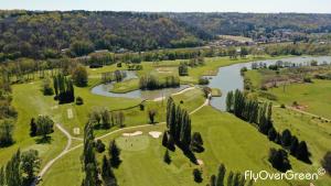 an aerial view of a golf course next to a river at L'entre-deux in Périgueux