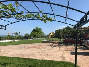 a playground with a basketball hoop in a park at PARADISE VILLA in Litochoro