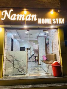 a sign for a woman home stay in a store at Naman Homestay in Amritsar