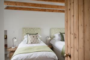 Postel nebo postele na pokoji v ubytování Beinn Cottage - Seasgair Lodges