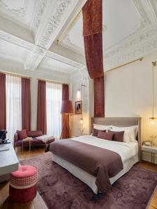 a bedroom with a large bed and a living room at Mr Cas Hotels Taksim - Special Category in Istanbul