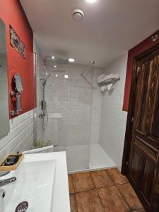 a bathroom with a shower and a sink and a tub at Apartamento Mikaela Alcalá de Henares in Alcalá de Henares +15 photos