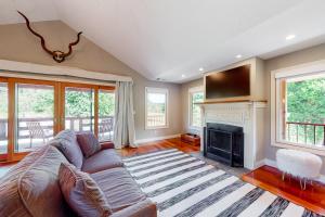 a living room with a couch and a fireplace at Emerald Acres in McKinleyville