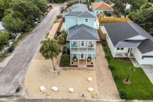 an aerial view of a house with a palm tree at The Lighthouse in Panama City Beach