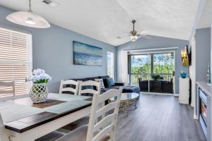 a dining room and living room with a dining table at Stunning 2BR Condo at Waterway Village in Myrtle Beach