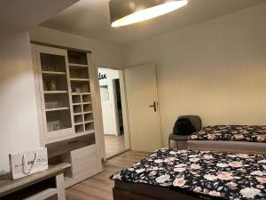 a small room with two beds and a closet at Elias 1 und 3 in Erfurt
