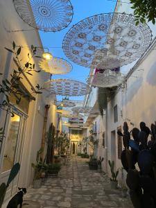 a hallway with umbrellas hanging from the ceilings at Borgo San Gaetano in Bernalda