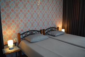 Postel nebo postele na pokoji v ubytování Velio Guest House