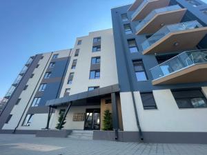 a large building with balconies on the side of it at L&C Platinum Property in Năvodari