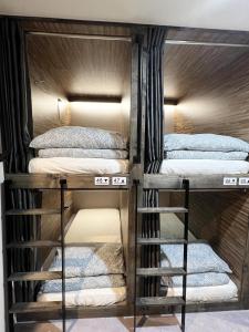 a group of bunk beds in a room at Seoul Cube Jongro in Seoul