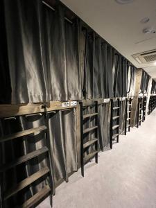 a row of empty baseball racks in a locker room at Seoul Cube Jongro in Seoul +72 photos