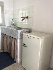 Kuchyň nebo kuchyňský kout v ubytování Appartamento in Piazza Spolethome