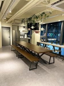 a group of tables and benches in a room at Seoul Cube Jongro in Seoul