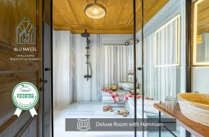 a bathroom with a bed and a sink in a room at Blu Macel Hotel & Suites -Old City Sultanahmet in Istanbul