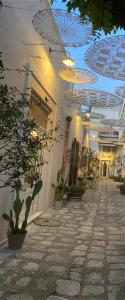 a building with a hallway with plants and a ceiling at Borgo San Gaetano in Bernalda