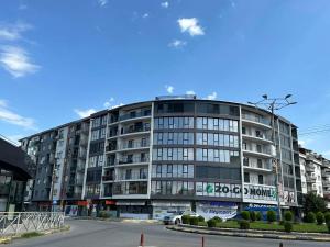 a large apartment building on a city street at Apartment33 in Strumica