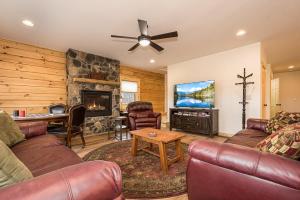 a living room with a couch and a fireplace at Johns Place in McHenry