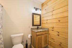 a bathroom with a toilet and a sink at Johns Place in McHenry +14 photos