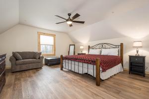 a bedroom with a bed and a ceiling fan at Johns Place in McHenry
