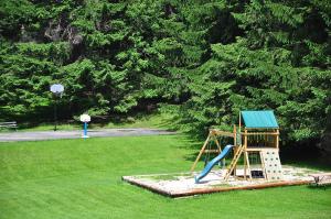 a playground with a slide in a park at Crazy Idea in Swanton