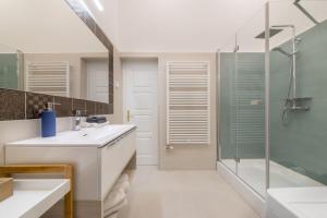a bathroom with a sink and a shower at Souper Apartments Downtown-Király Street in Budapest