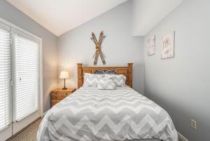 a bedroom with a large bed and a window at Villages of Wisp 08 Winding Way in McHenry